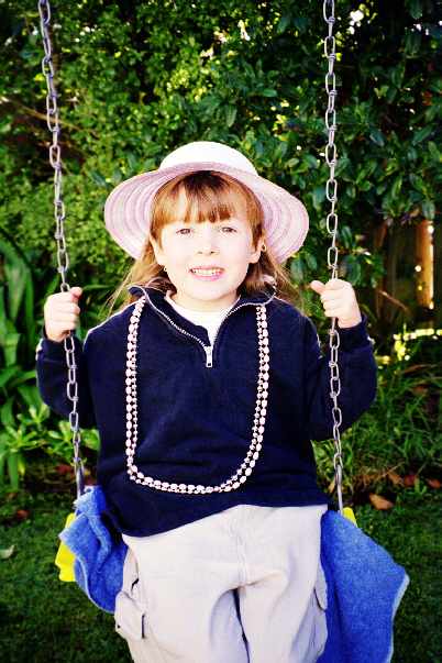 All dressed up playing on my swing